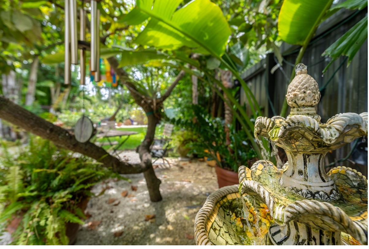 Lush tropical garden with a fountain at a Miami home